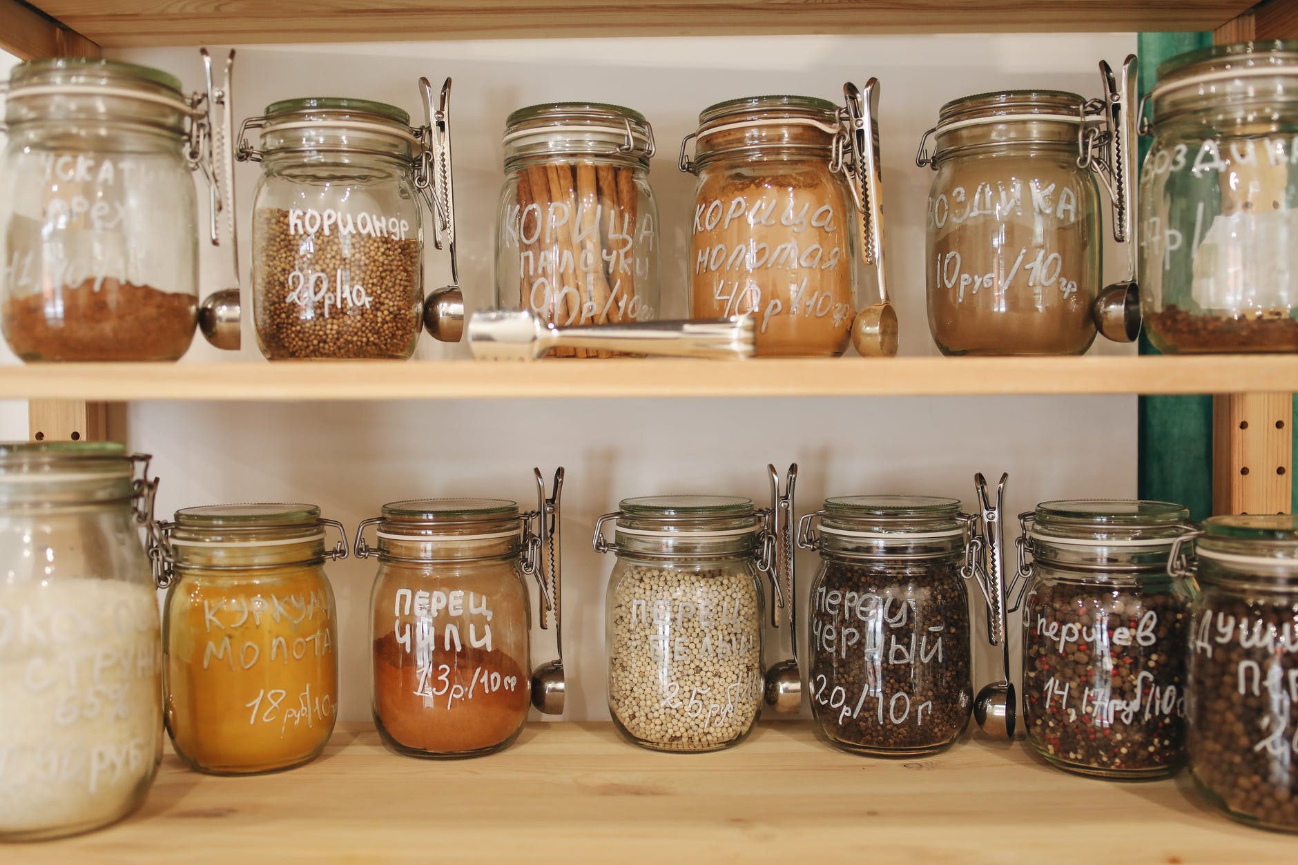 glass jars on wooden shelf