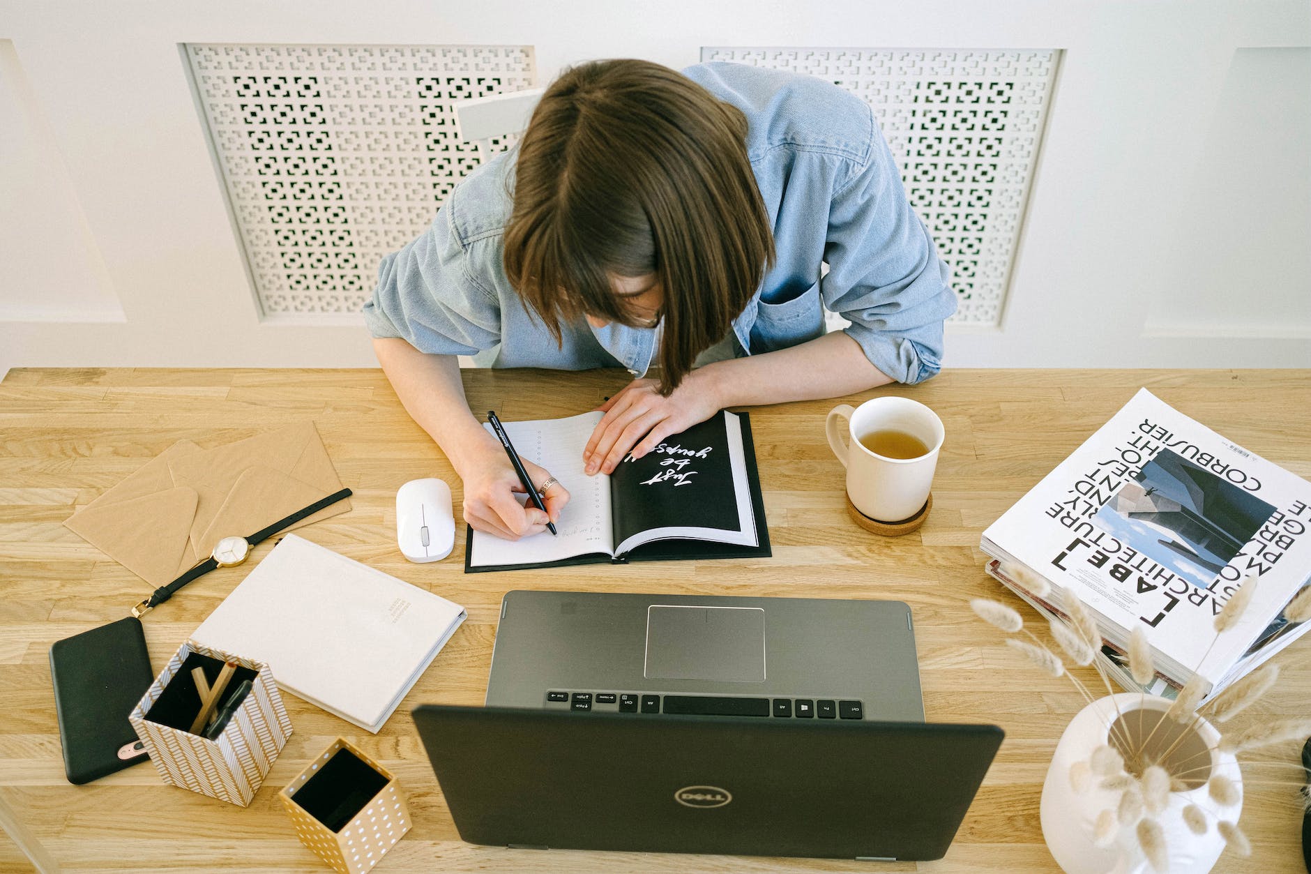 woman writing in notebook