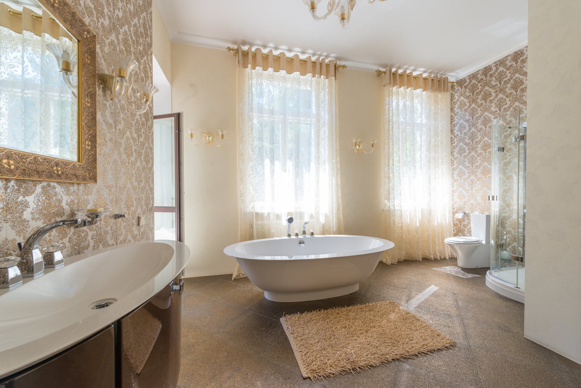 modern beige bathroom with clean white bathtub