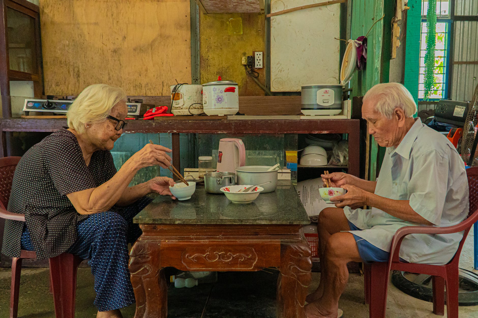 elderly couple eating together
