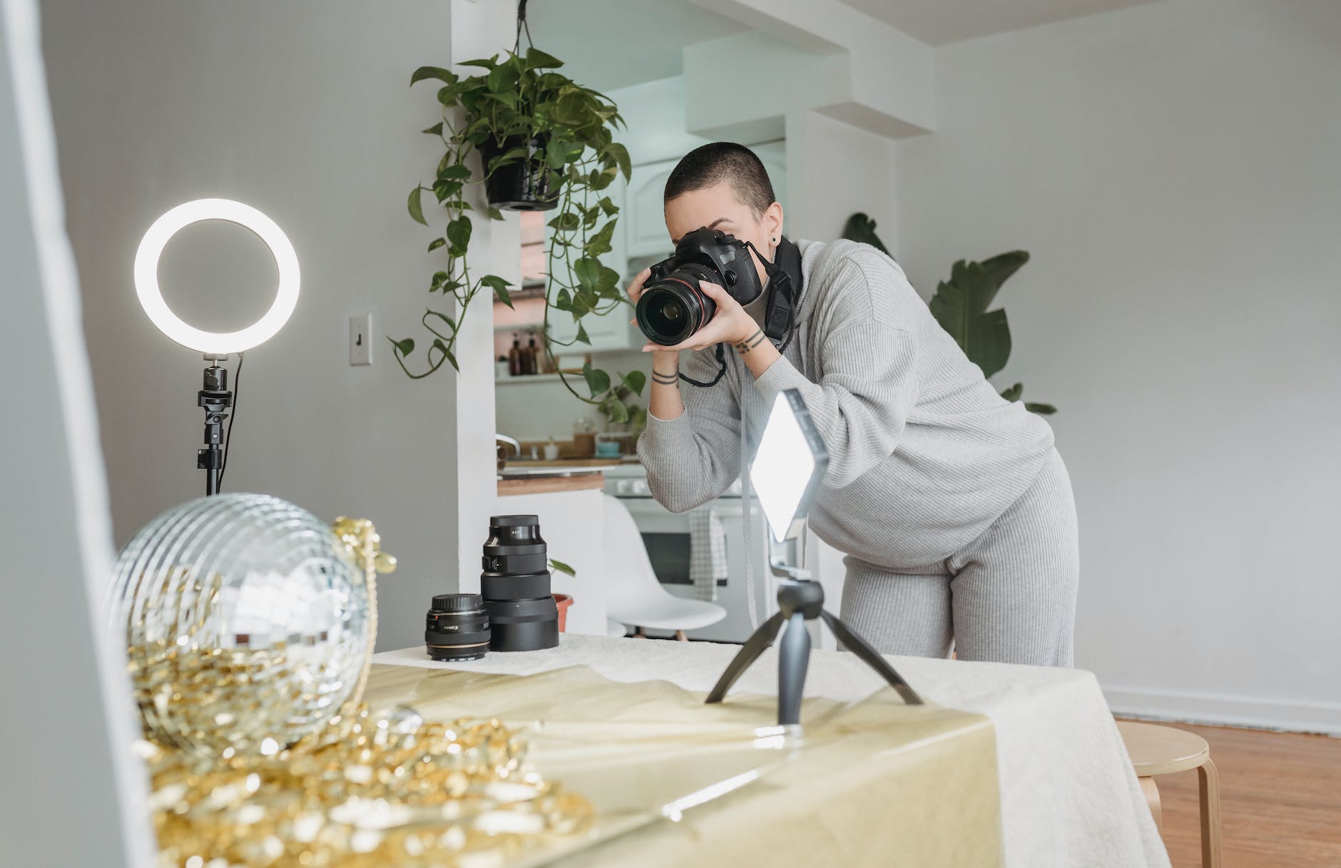 photographer shooting party ball and shiny tinsel placed on table
