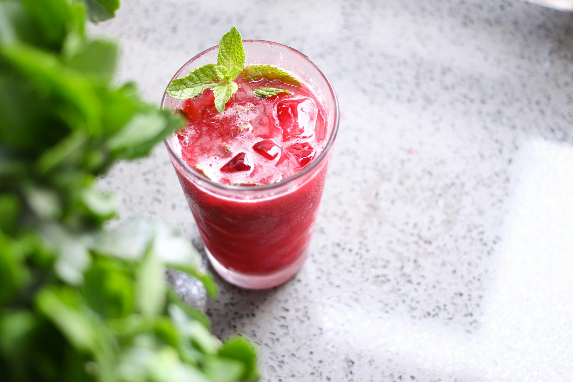 mint leaves garnished on a fruit juice
